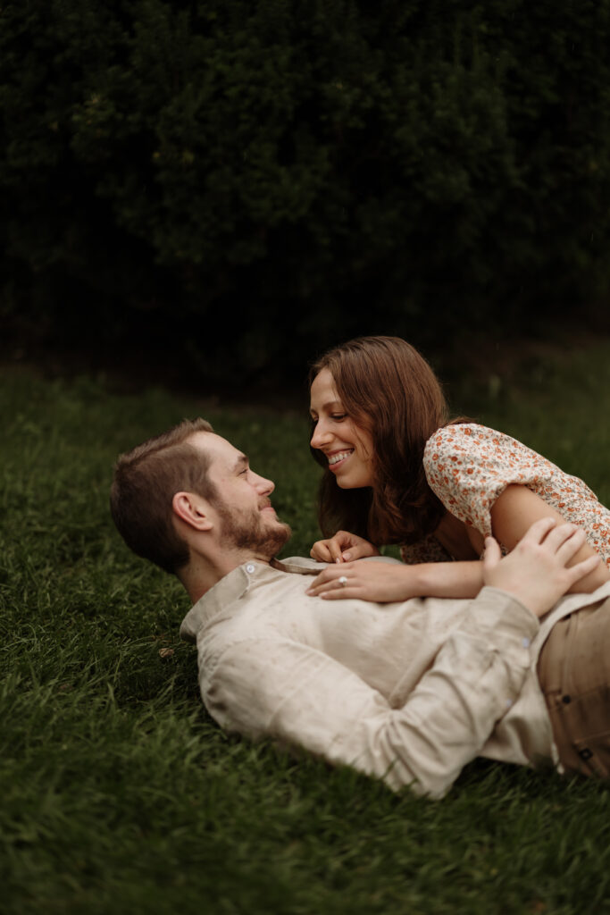 Rolling in the grass Romantic Photo of couple during Couples Photoshoot.