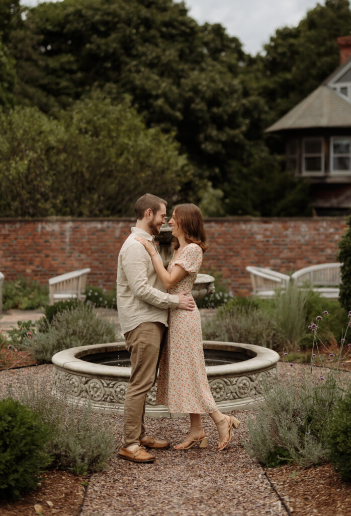 Photo of couple in front of a water fountain at Shelburne Farms in Shelburne, Vermont.
