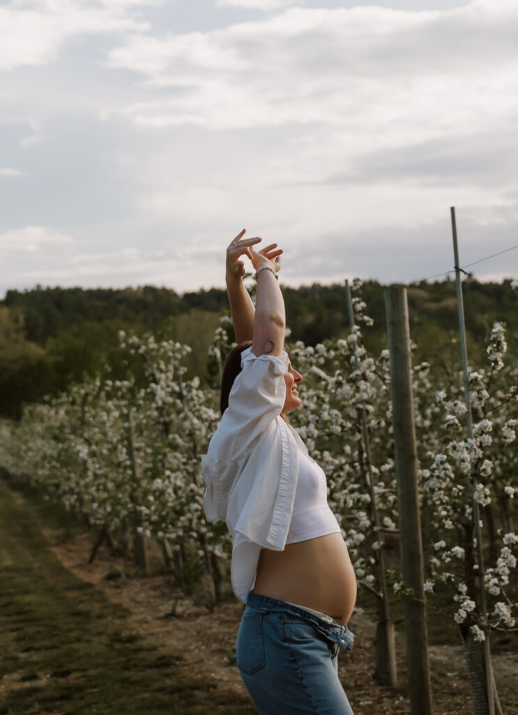 Damini Photography: Stunning Newborn and Maternity Photoshoots Amidst Vermont’s Spring Apple Blossom Trees.