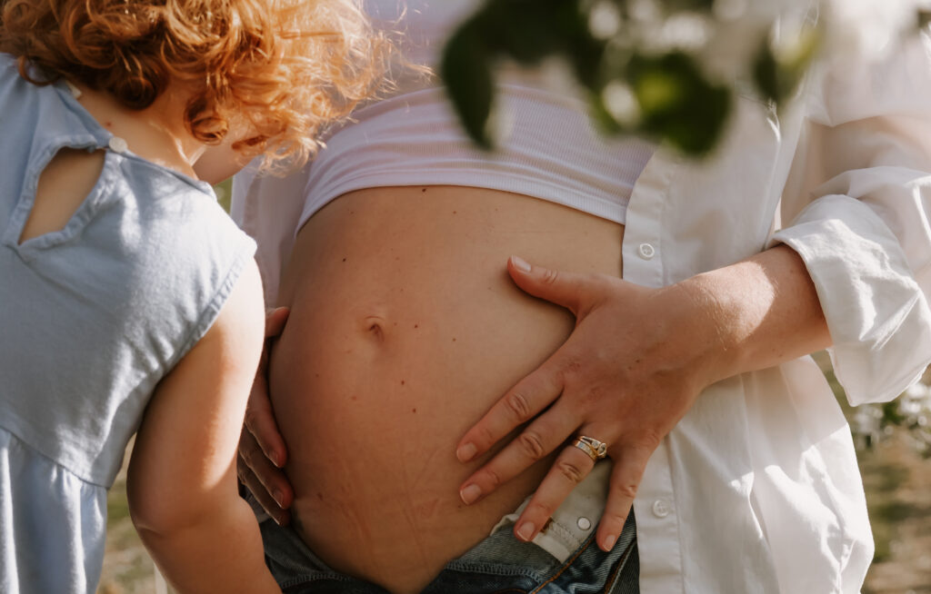 Newborn and Maternity Photoshoots in the Beautiful Vermont Spring Apple Trees by Damini Photography.