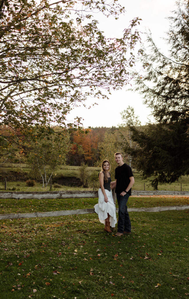 Engagement photos with rustic fall scenery and vibrant autumn colors