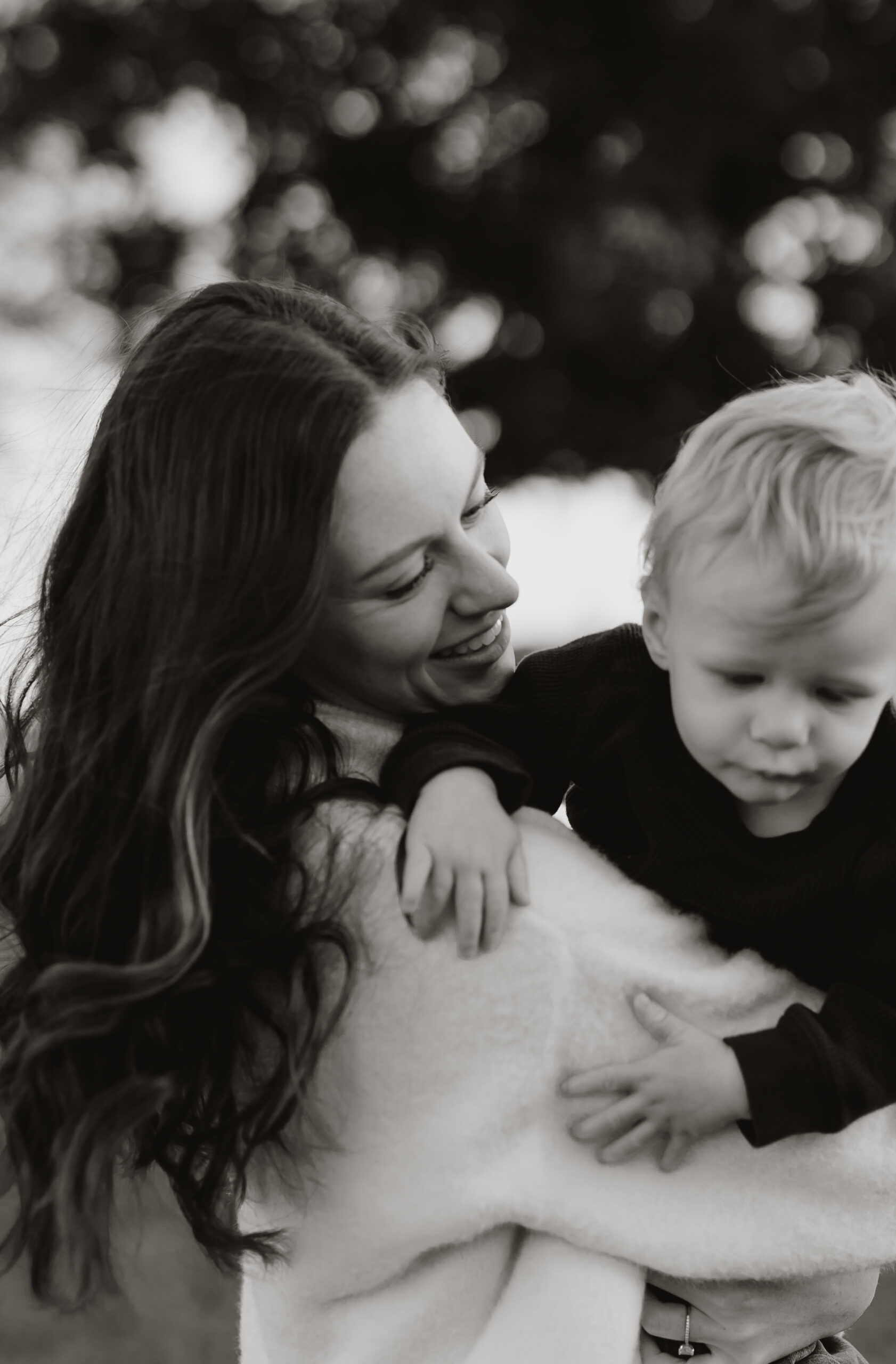 New England Family Photo of Mother holding son in the air
