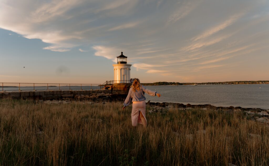 Capture timeless portrait photography along the rugged coast of Maine with a stunning lighthouse backdrop at sunset. These landscape-style sessions blend natural light, ocean views, and iconic coastal scenery to create striking, storytelling portraits featuring both people and place. Perfect for couples, families, and individual sessions looking for a classic Maine coastal aesthetic with a cinematic, golden-hour feel.