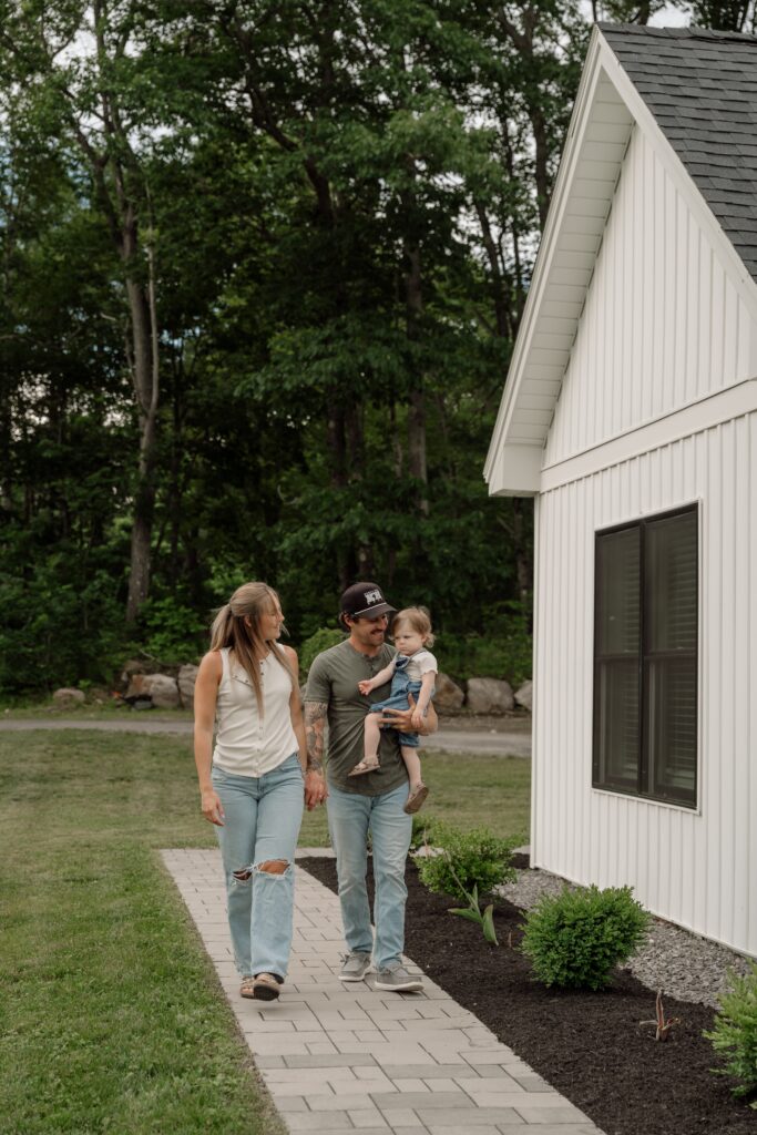 In-home lifestyle family photography session in Gardiner, Maine featuring authentic connections between parents and children outdoors