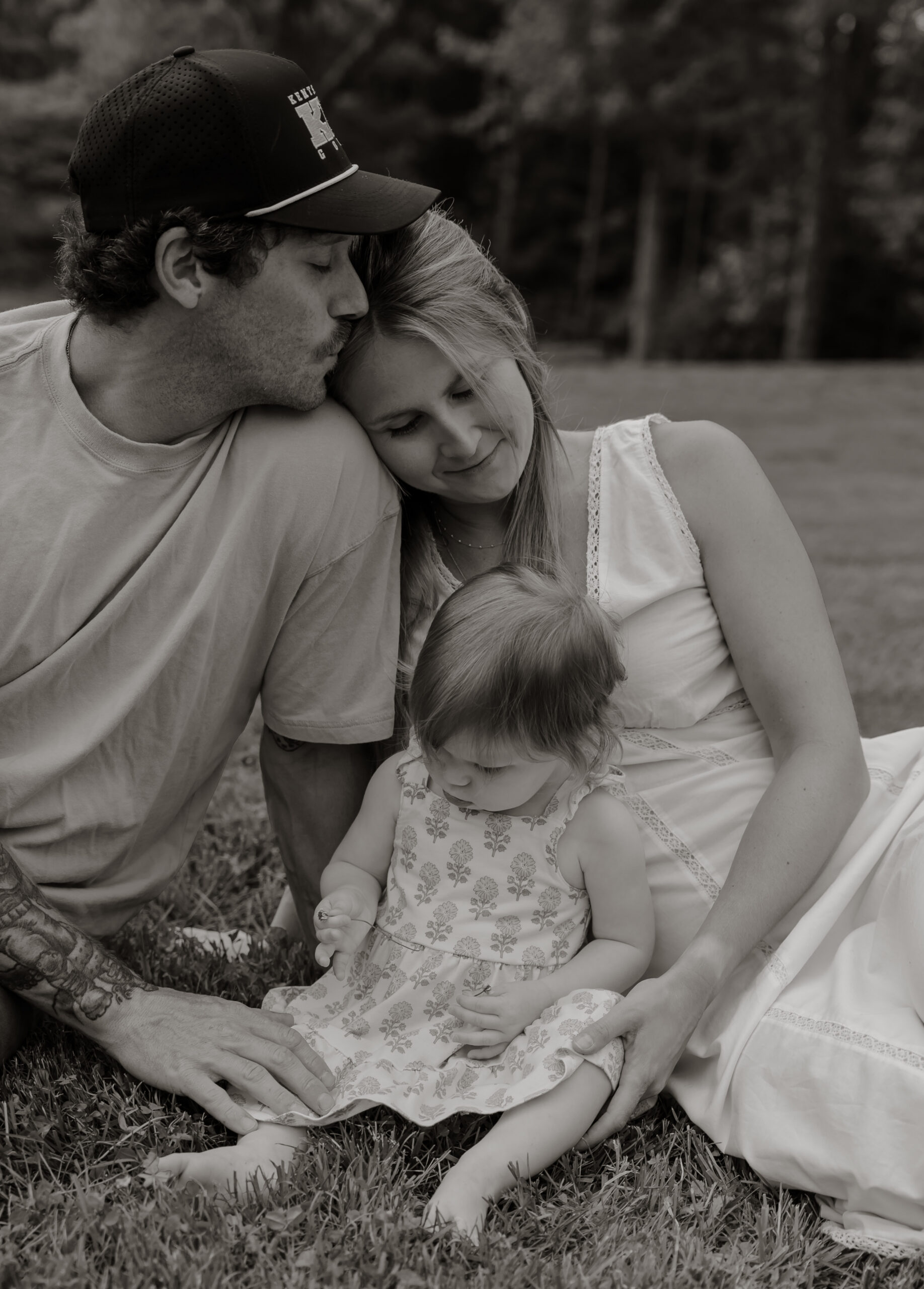 Parents and children sharing a joyful moment during an in-home family photography session in Gardiner, Maine